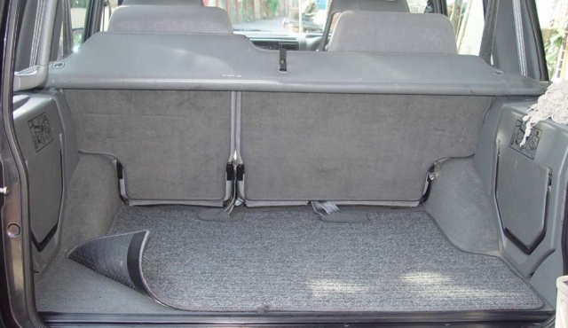 Trunk carpet attachment